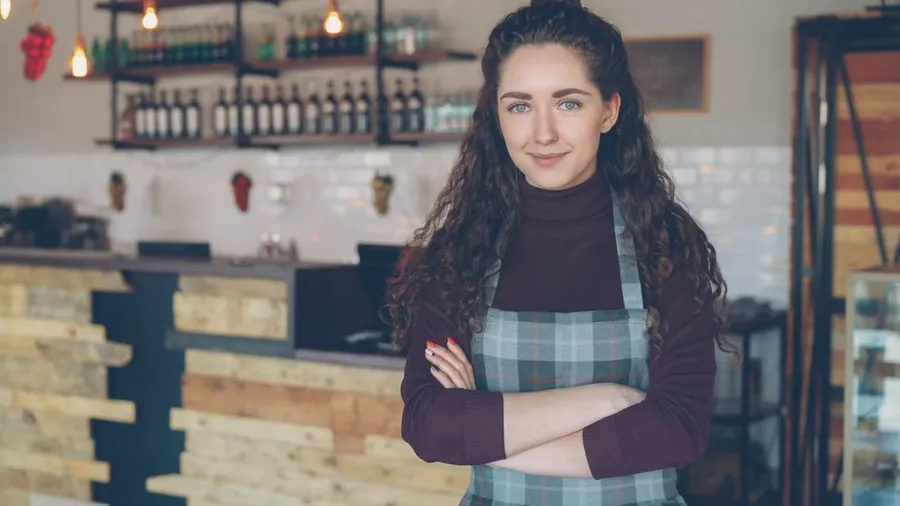 A cafe owner standing in her cafe